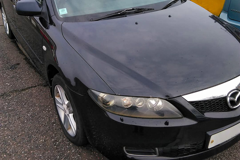 Why was the Mazda 6 displaying an alarm fault?