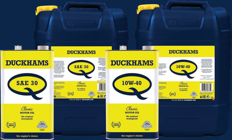 A product lineup of Duckhams Classic motor oils, showing yellow metal tins and large blue plastic containers for SAE 30 and 10W-40 grades.