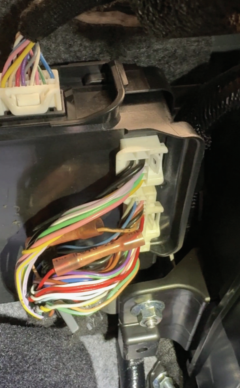 Fig 4 – The red wire here with the pink crimp connector is the feedback from what appeared to be a magneto resistive type sensor in the automatic transmission mechatronics – this was the real smoking gun.